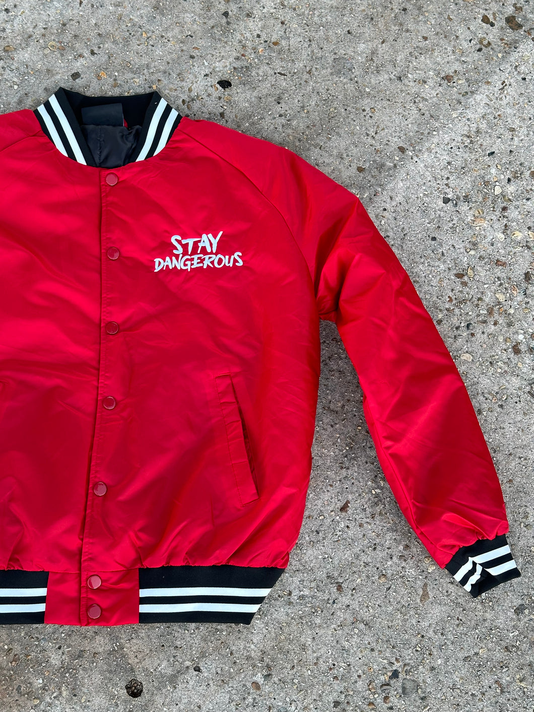 Stay Dangerous red bomber jacket